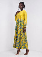 "Alfajiri" Long Sleeve Maxi Dress — three-quarter view on model