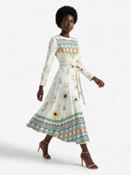 "Alizeti" Long Sleeve Midaxi Dress — three-quarter view on model, hand in the side pocket
