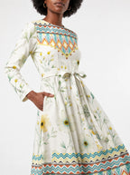 "Alizeti" Long Sleeve Midaxi Dress — close-up of the tie sash and the in-seam side pocket