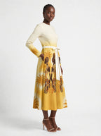 "Ancestral Flame" Long Sleeve Midaxi Dress — three-quarter view on model, hand in the side pocket