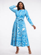 "Anga" Long Sleeve Midaxi Dress — three-quarter view on model, hand in the side pocket