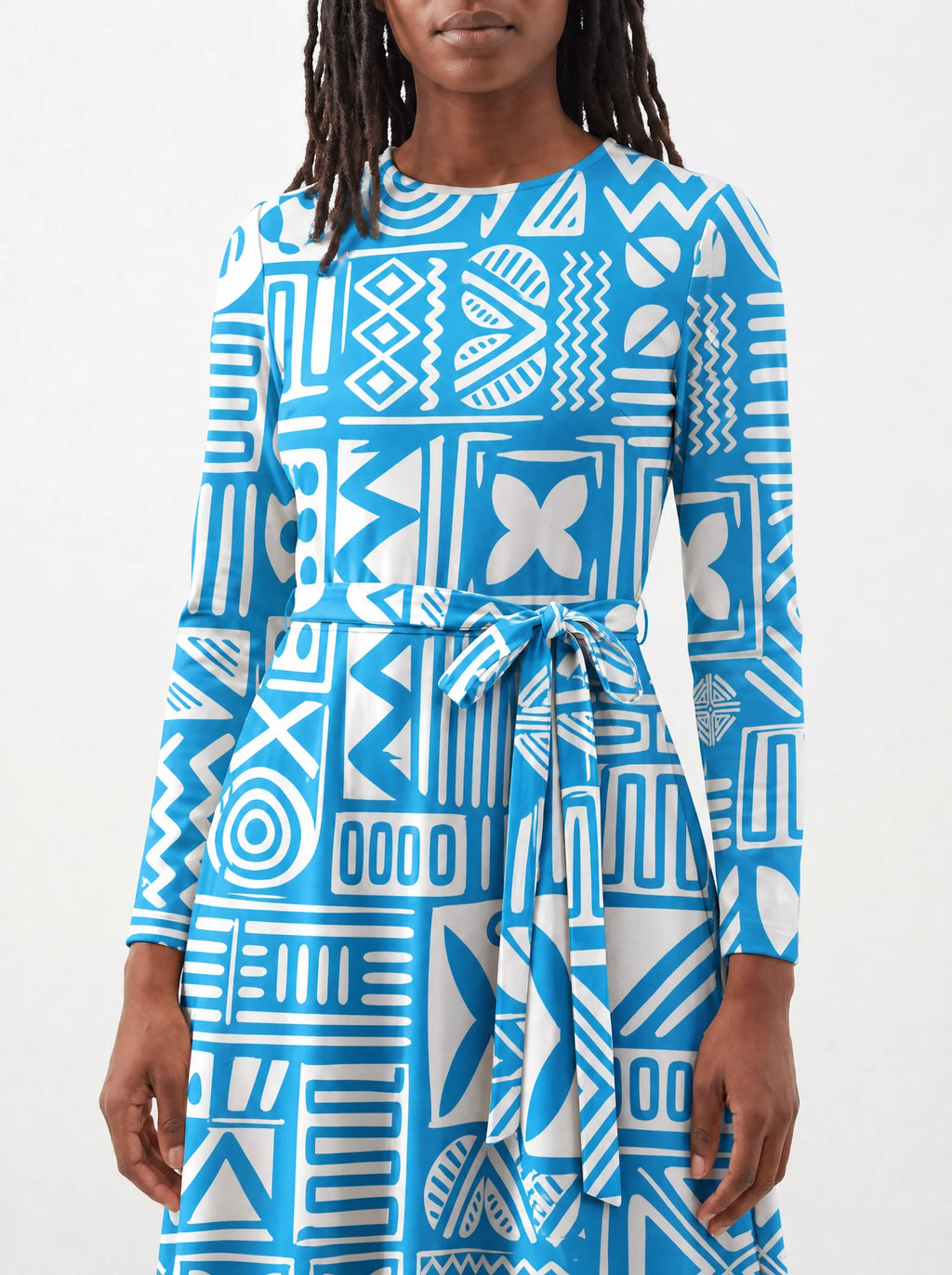"Anga" Long Sleeve Midaxi Dress — close-up of the tie sash and the in-seam side pocket