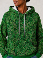 "Asili" Emerald Hoodie — close-up on model