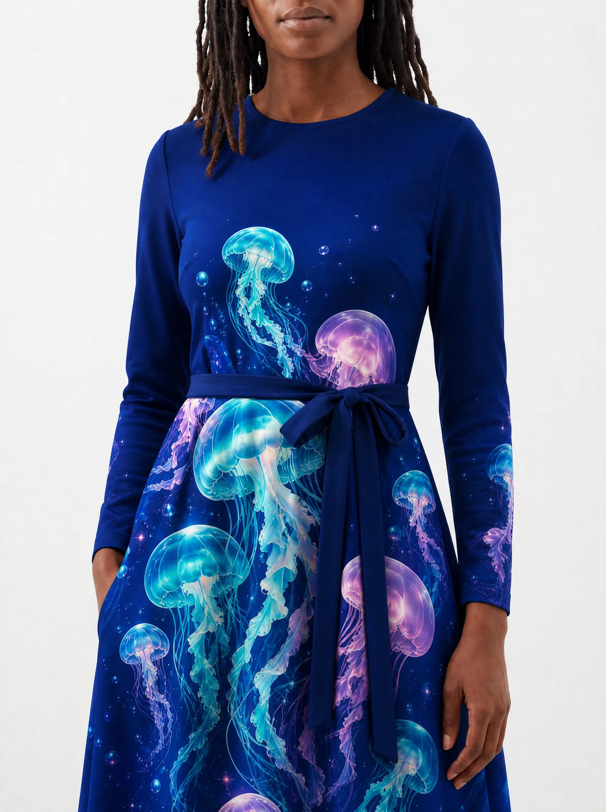 "Bahari" Long Sleeve Midaxi Dress — close-up of the tie sash and the in-seam side pocket
