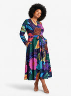 "Bustani" Long Sleeve Midaxi Dress — three-quarter view on model, hand in the side pocket