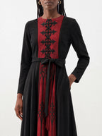 "Carmilla" Long Sleeve Midaxi Dress — standing, angled view on model