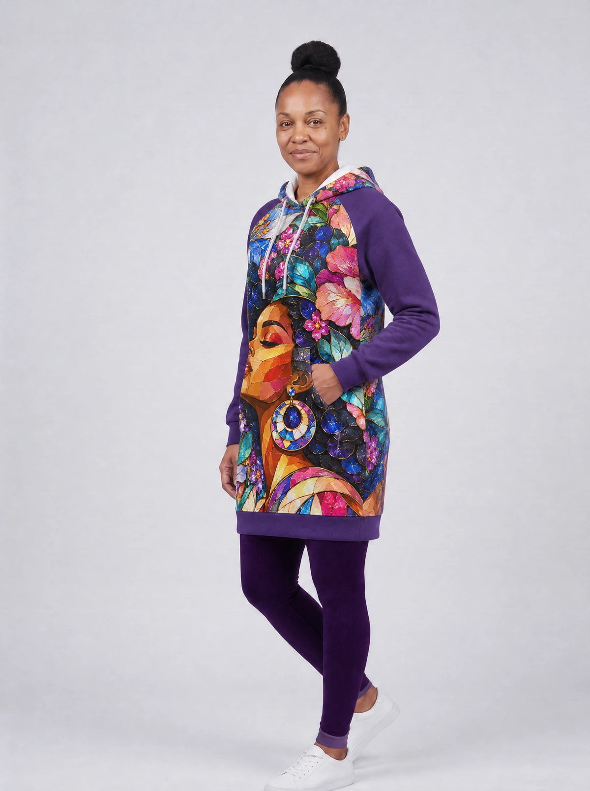 "Dirisha" Hoodie Dress — three-quarter view on model, hand in pocket, styled with the matching leggings