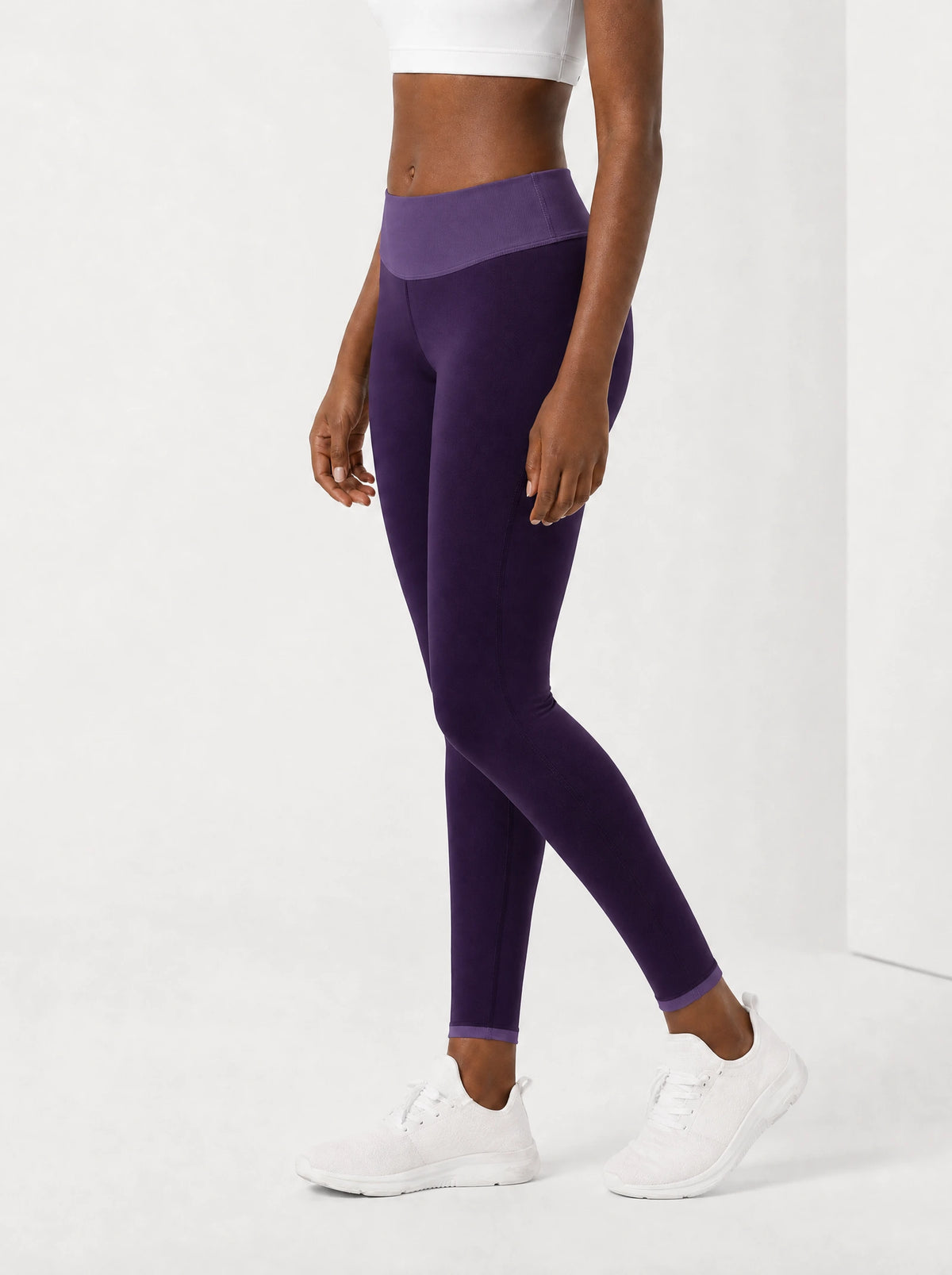 "Dirisha" Leggings — side view on model, walking