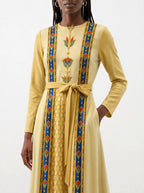 "Egyptian Queen" Long Sleeve Midaxi Dress — standing, angled view on model