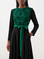 "Green Witch" Long Sleeve Midaxi Dress — standing, angled view on model
