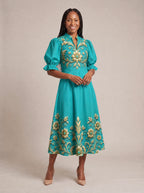 "Heshima" Puff Sleeve Dress — walking, three-quarter view on model