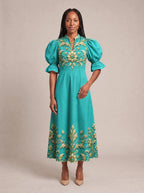 "Heshima" Puff Sleeve Dress — standing, angled view on model