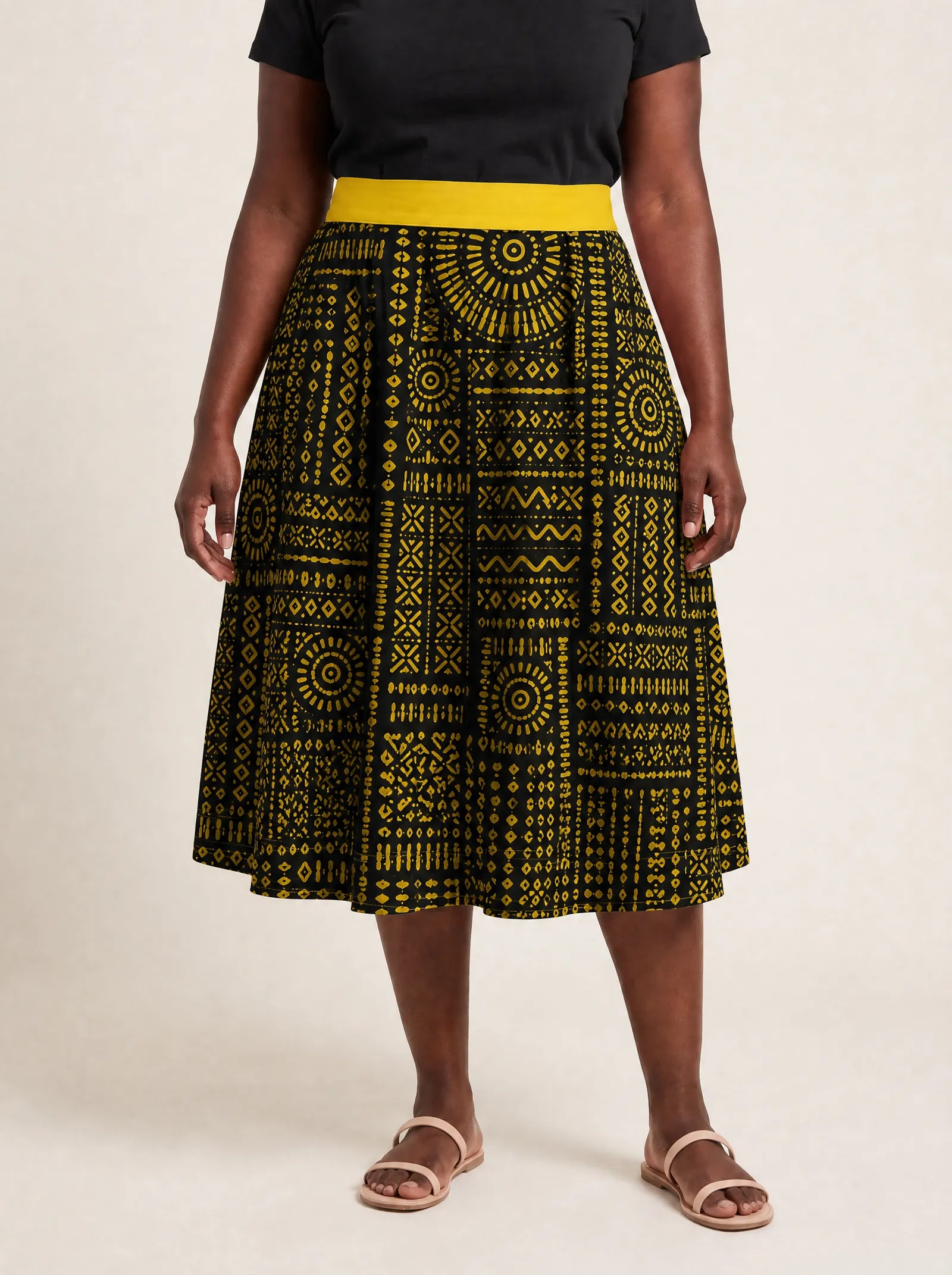"Lamu" Twirl Skirt — cropped front view on model