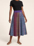 "Oshun Zamani" Twirl Skirt — cropped front view on model