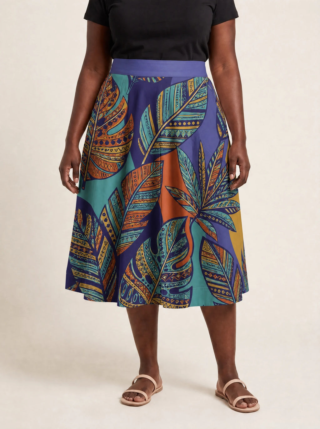 "Majani" Twirl Skirt — cropped front view on model