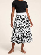 "Milia" Twirl Skirt — cropped front view on model