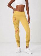Yellow Orchid Leggings — front view on model