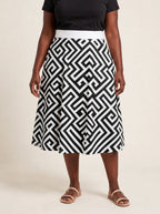 "Zamu" Twirl Skirt — cropped front view on model
