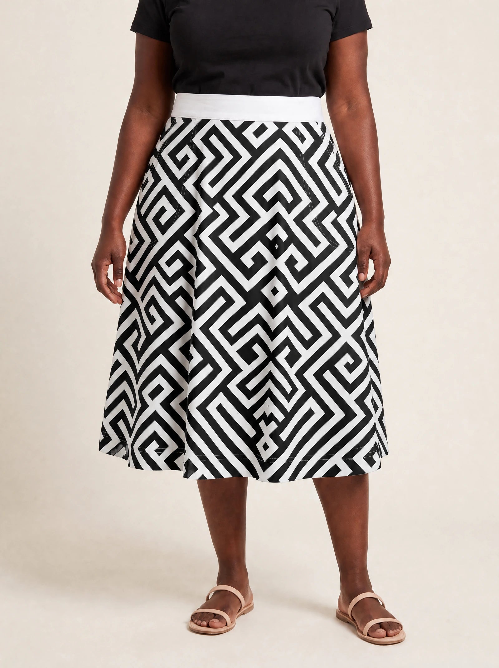 "Zamu" Twirl Skirt — cropped front view on model