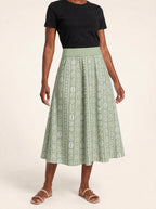 "Oshun Verde" Twirl Skirt — cropped front view on model