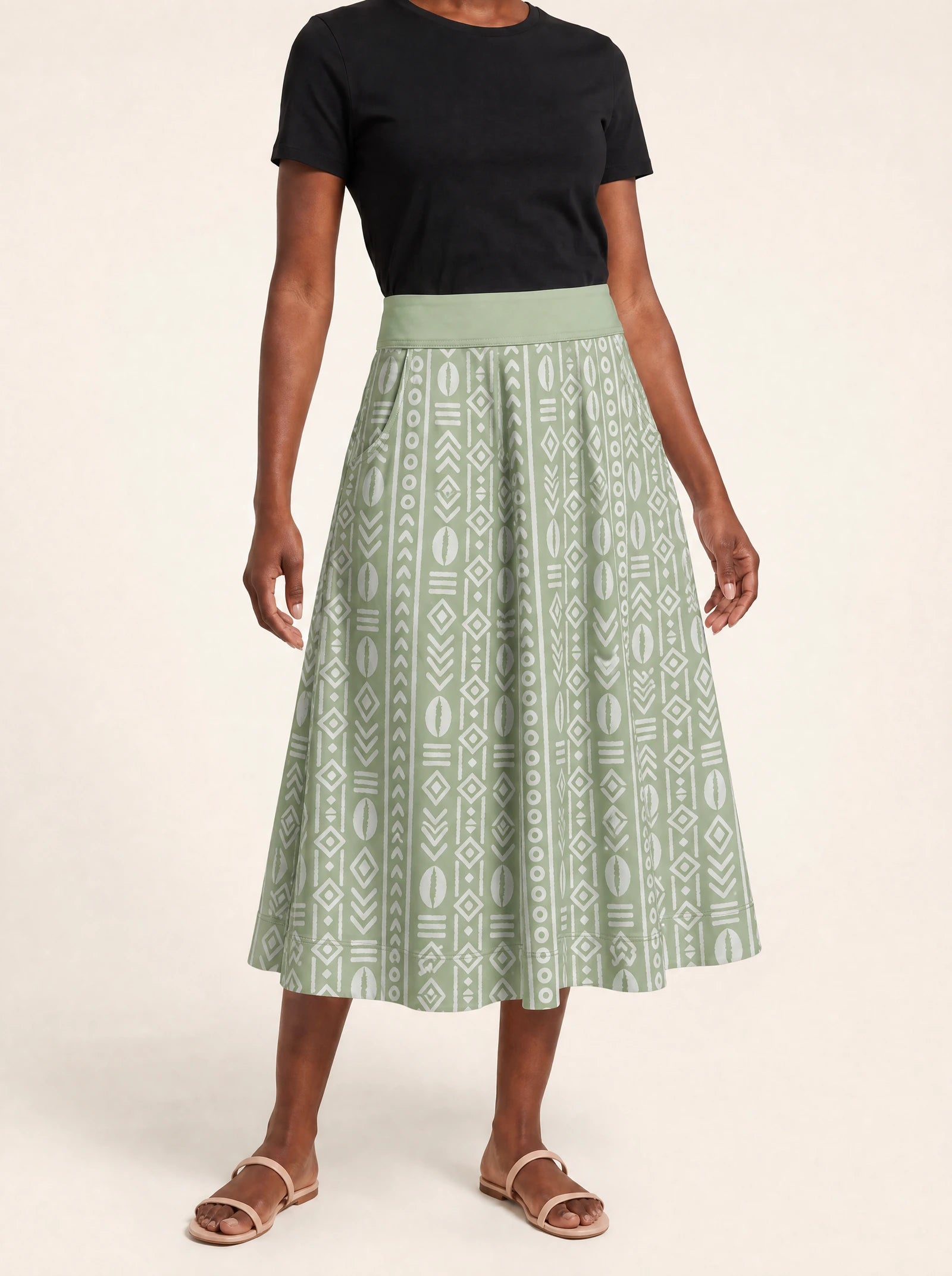 "Oshun Verde" Twirl Skirt — cropped front view on model