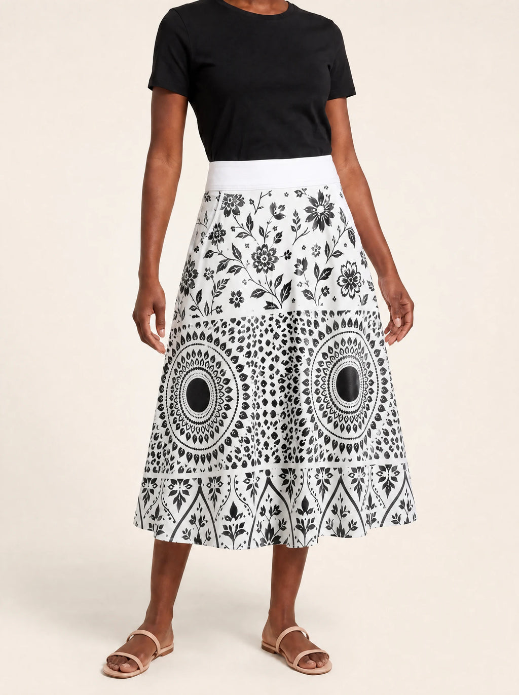 "Mwanga" Twirl Skirt — cropped front view on model