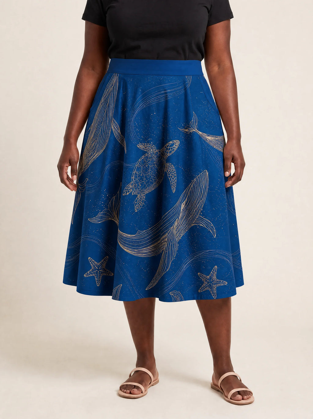 "Pwani" Twirl Skirt — cropped front view on model