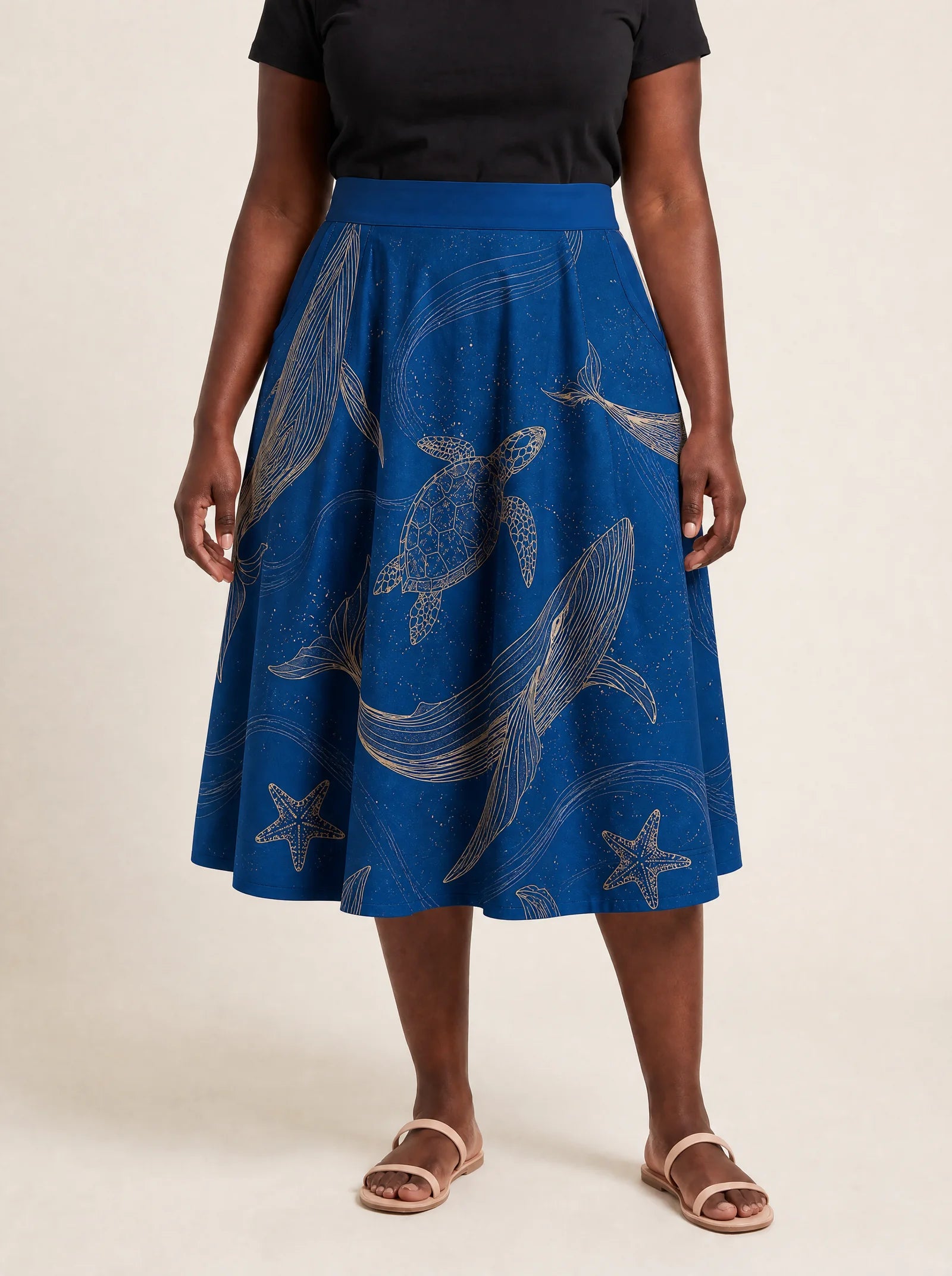 "Pwani" Twirl Skirt — cropped front view on model