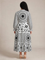 "Mwanga" Long Puff Sleeve Dress — back view on model