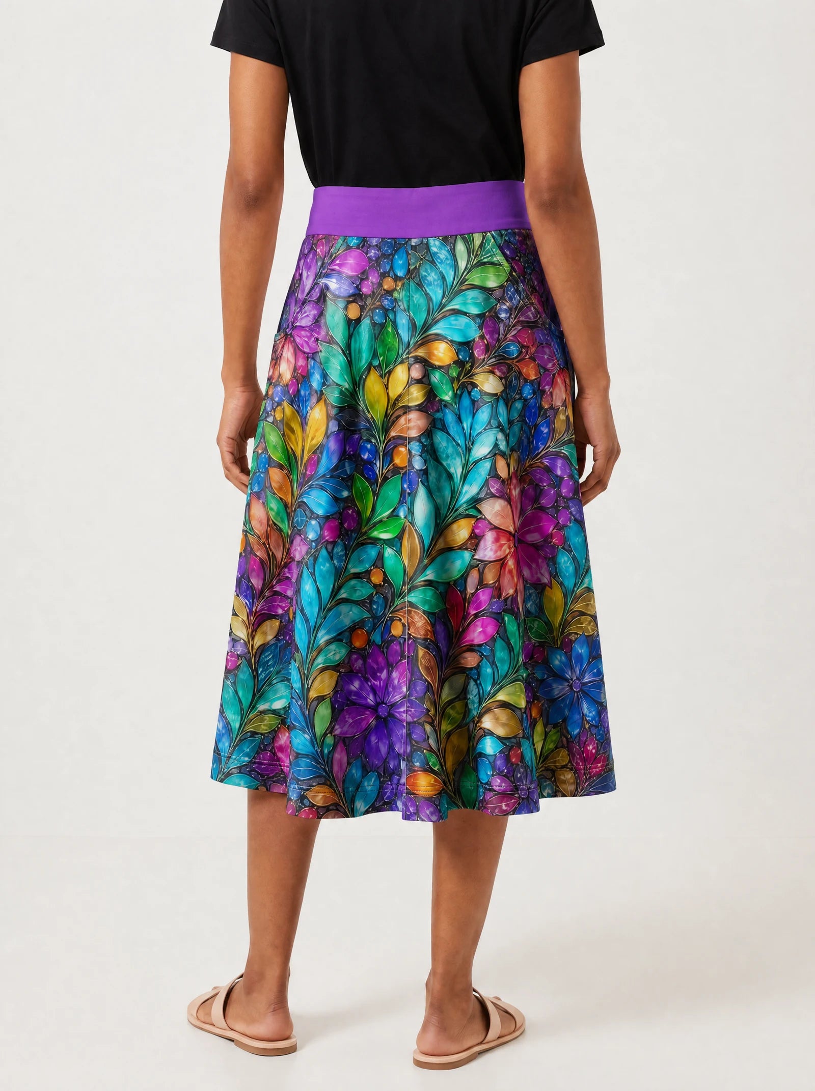 "Upinde" Twirl Skirt — cropped back view on model
