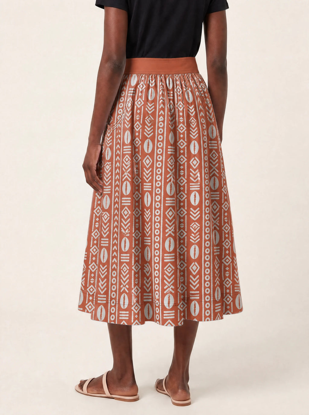 "Oshun Kijani" Twirl Skirt — cropped back view on model