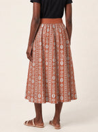 "Oshun Kijani" Twirl Skirt — cropped back view on model