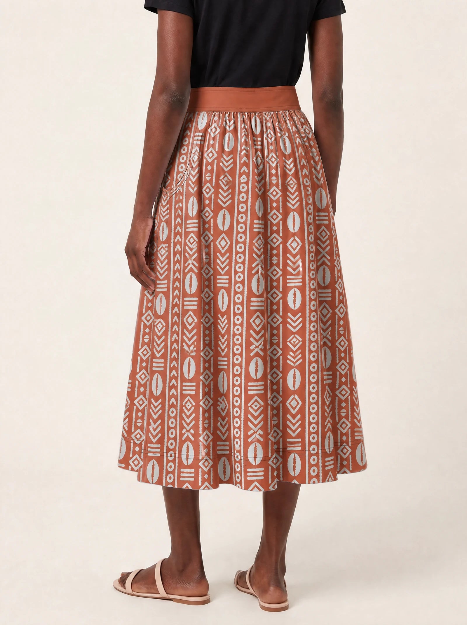 "Oshun Kijani" Twirl Skirt — cropped back view on model