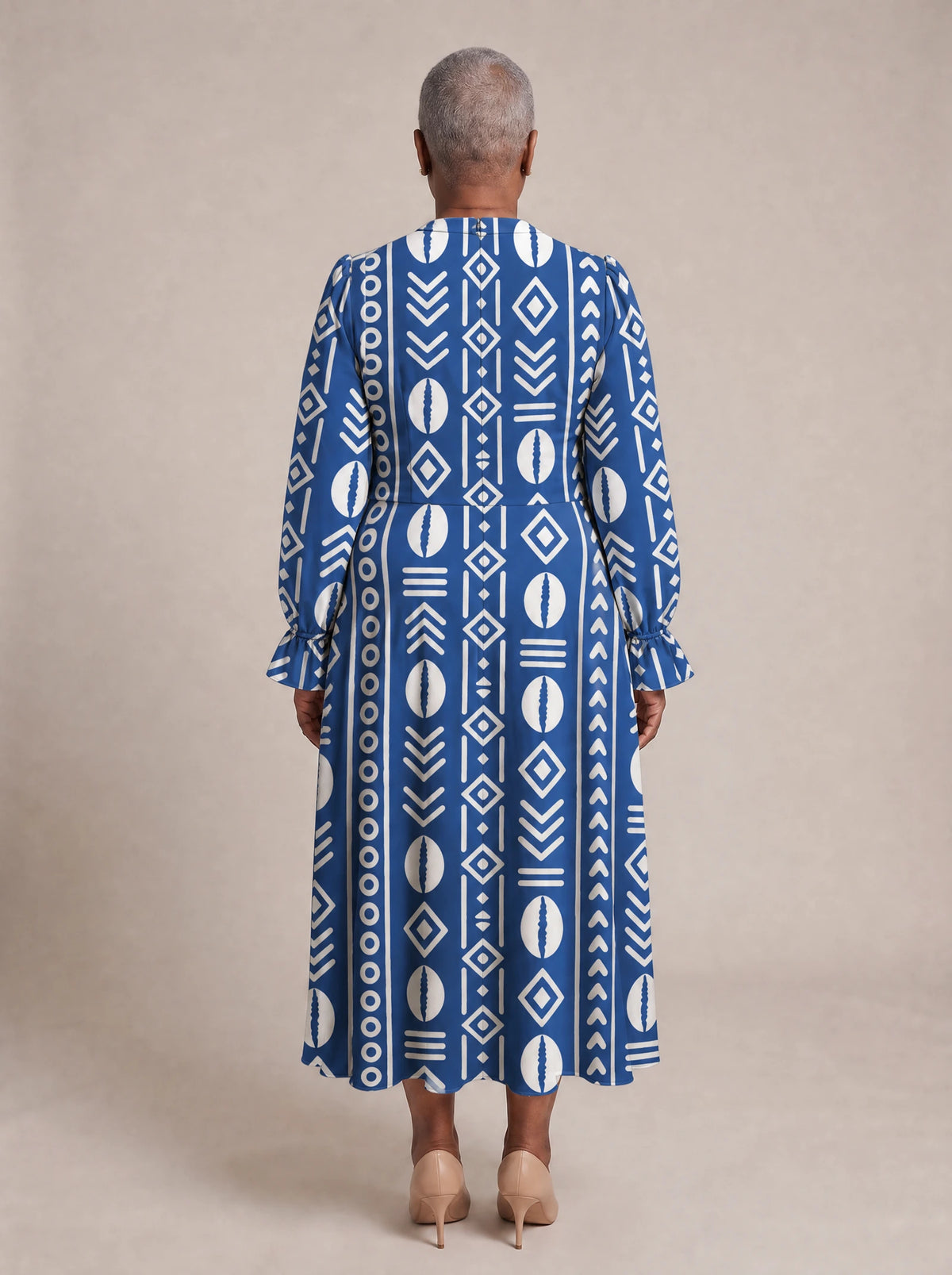 "Oshun" Royal Blue Long Puff Sleeve Dress — back view on model