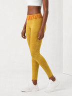 Black Excellence Leggings — side view on model
