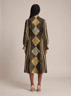 "Fataki" Long Puff Sleeve Dress — back view on model