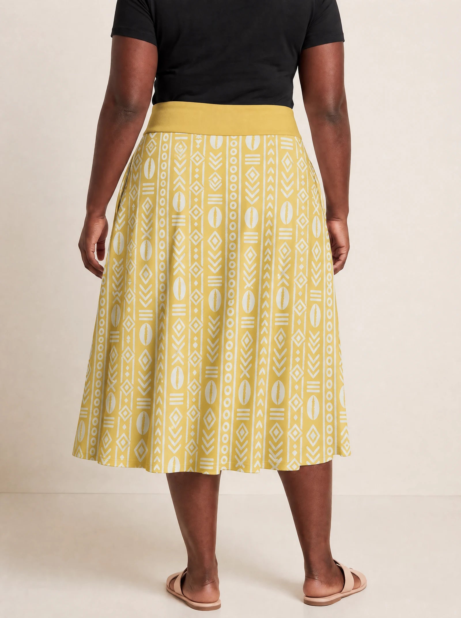 "Oshun Dhahabu" Twirl Skirt — cropped back view on model