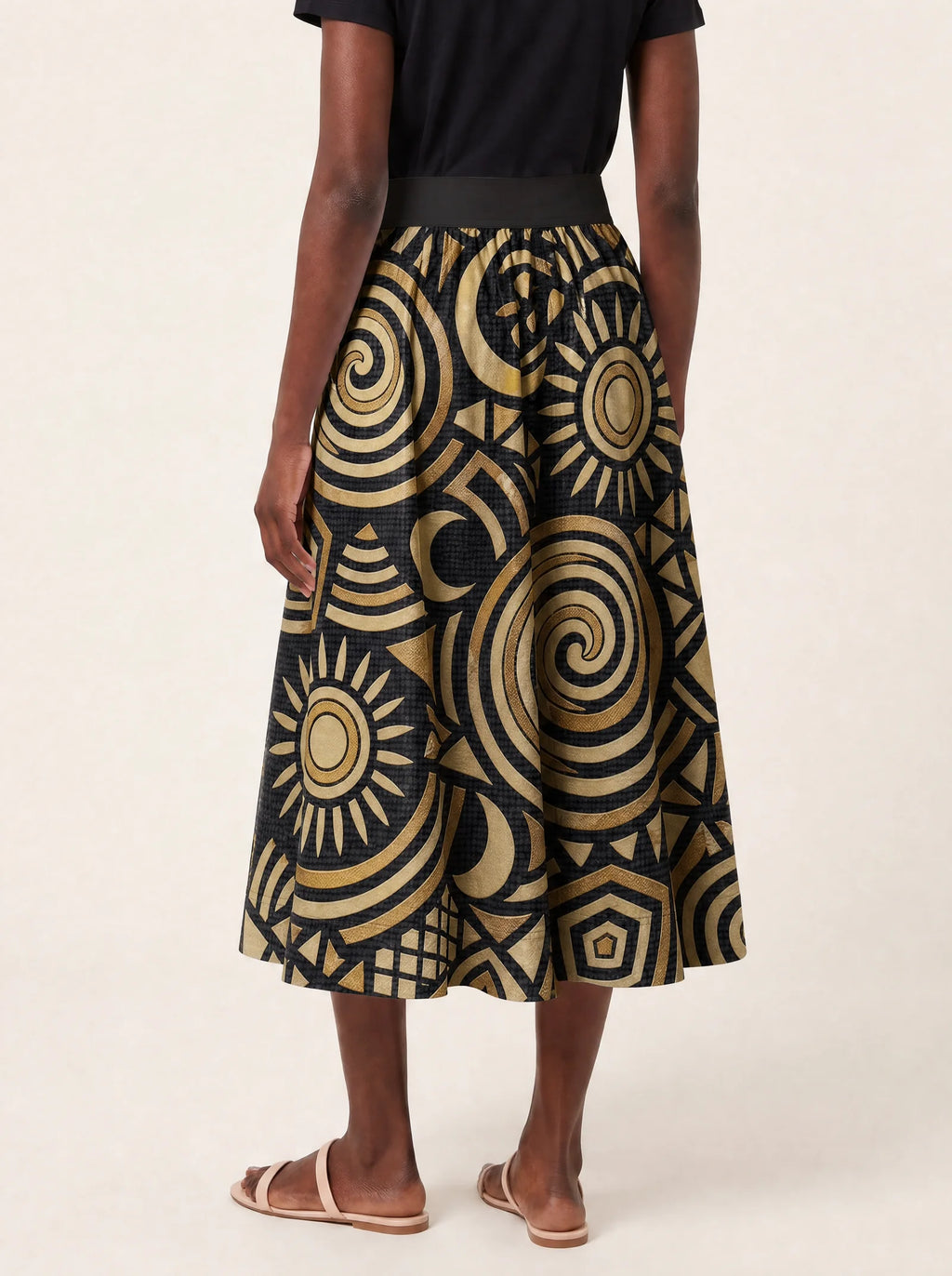 "Sahara" Twirl Skirt — cropped back view on model