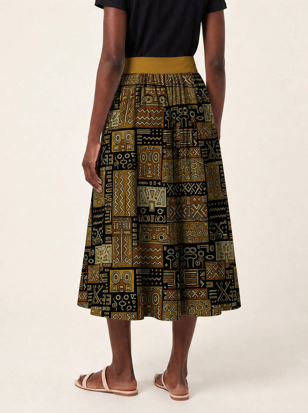 "Sankofa" Twirl Skirt — cropped back view on model