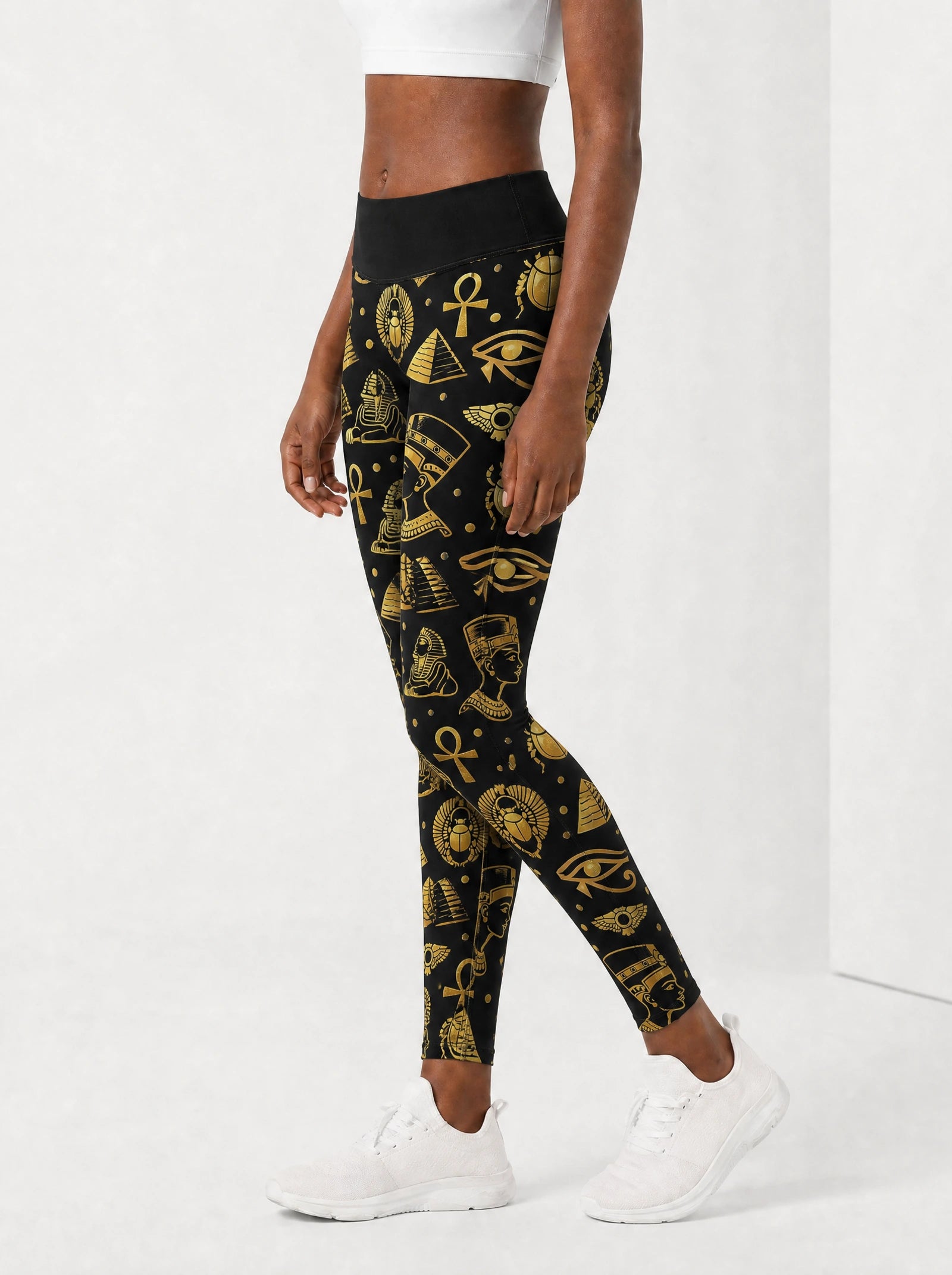 "Nefertiti" Black Gold Leggings — side view on model