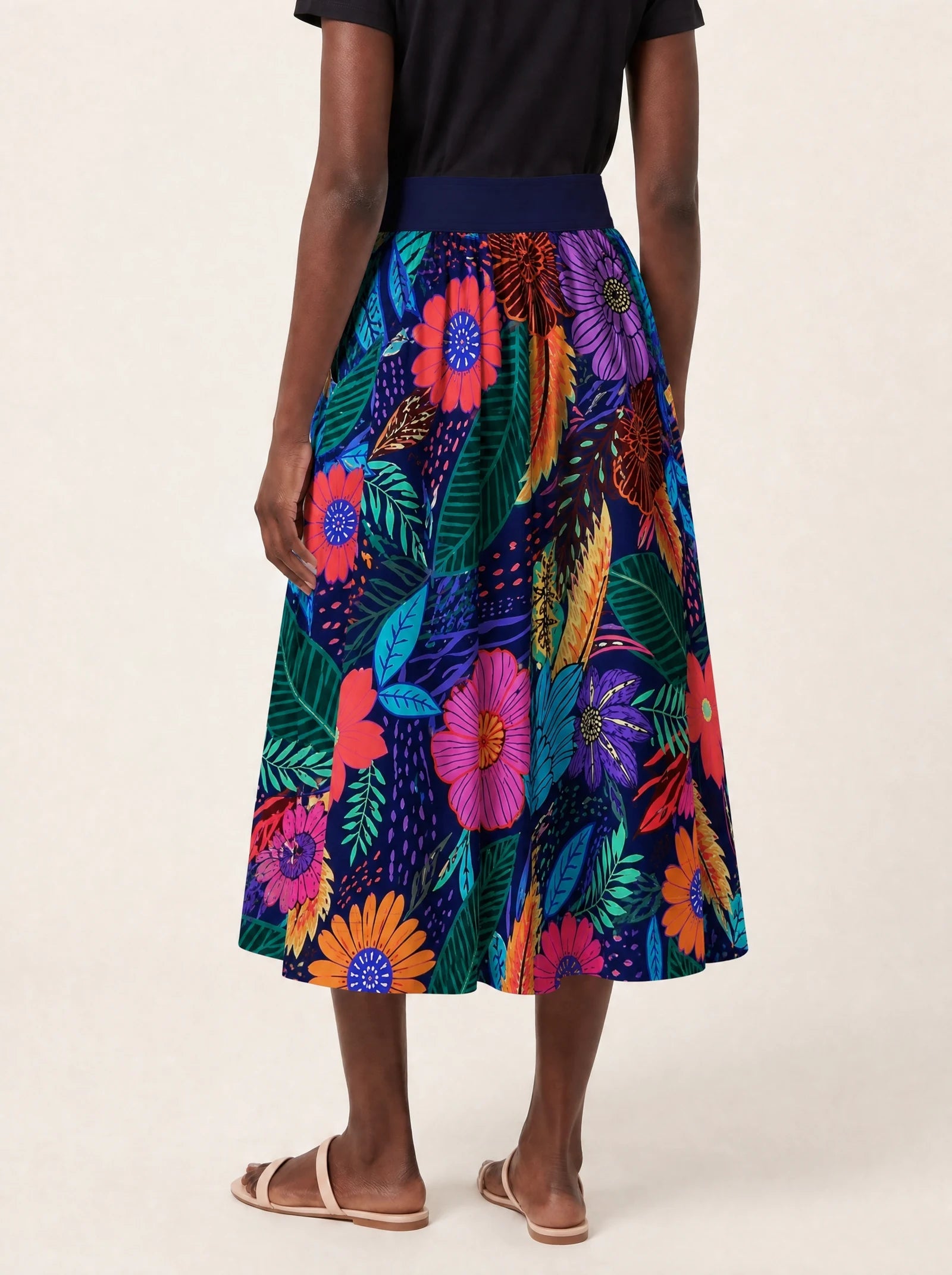 "Bustani" Twirl Skirt — cropped back view on model