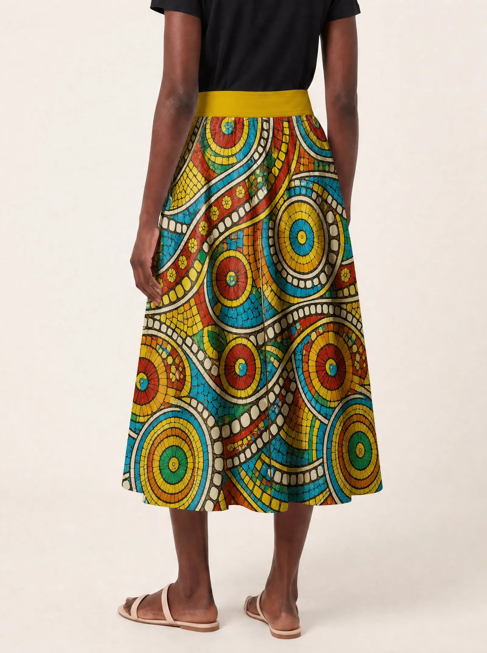"Taji" Twirl Skirt — cropped back view on model