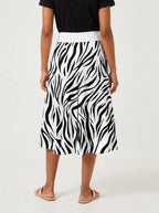 "Milia" Twirl Skirt — cropped back view on model
