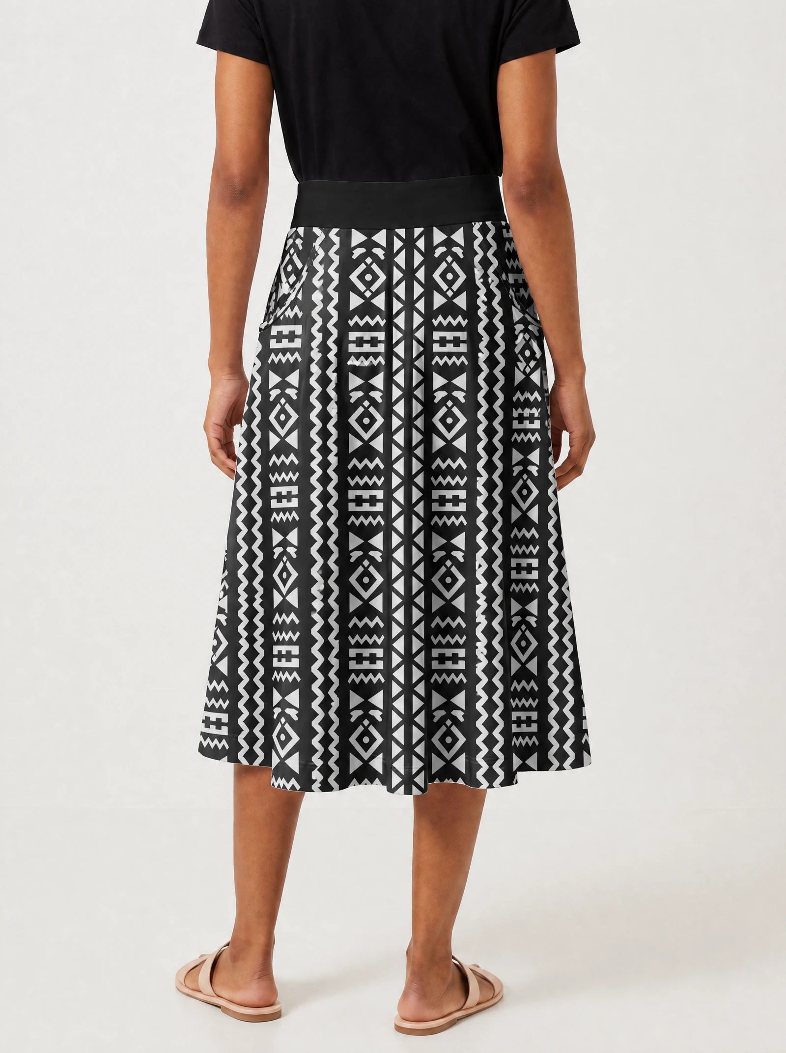 "Kuba" Twirl Skirt — cropped back view on model