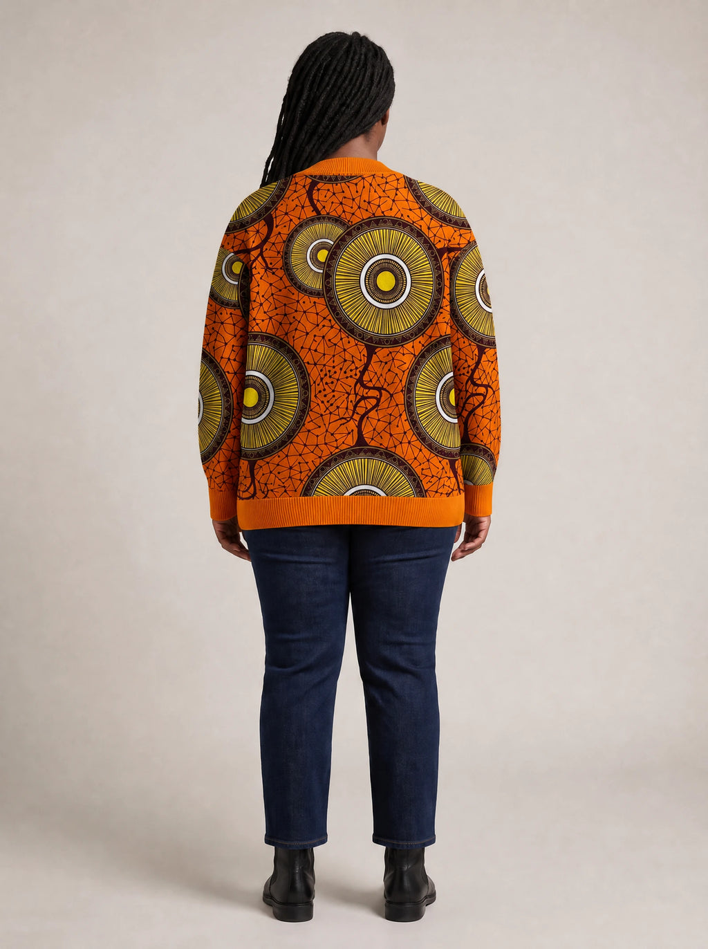 "Mchana" Knitted Cardigan — back view on model