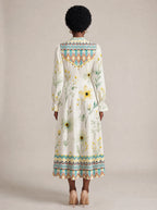 "Alizeti" Long Puff Sleeve Dress — back view on model
