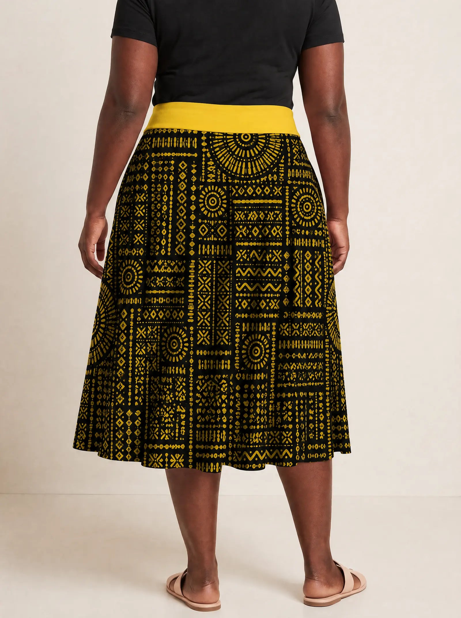 "Lamu" Twirl Skirt — cropped back view on model