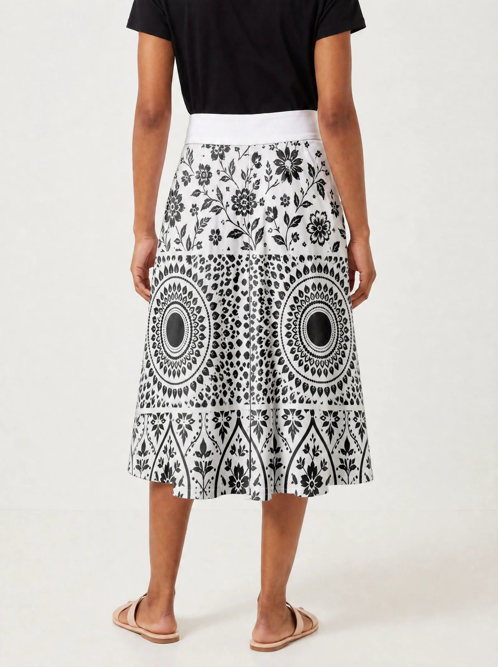 "Mwanga" Twirl Skirt — cropped back view on model