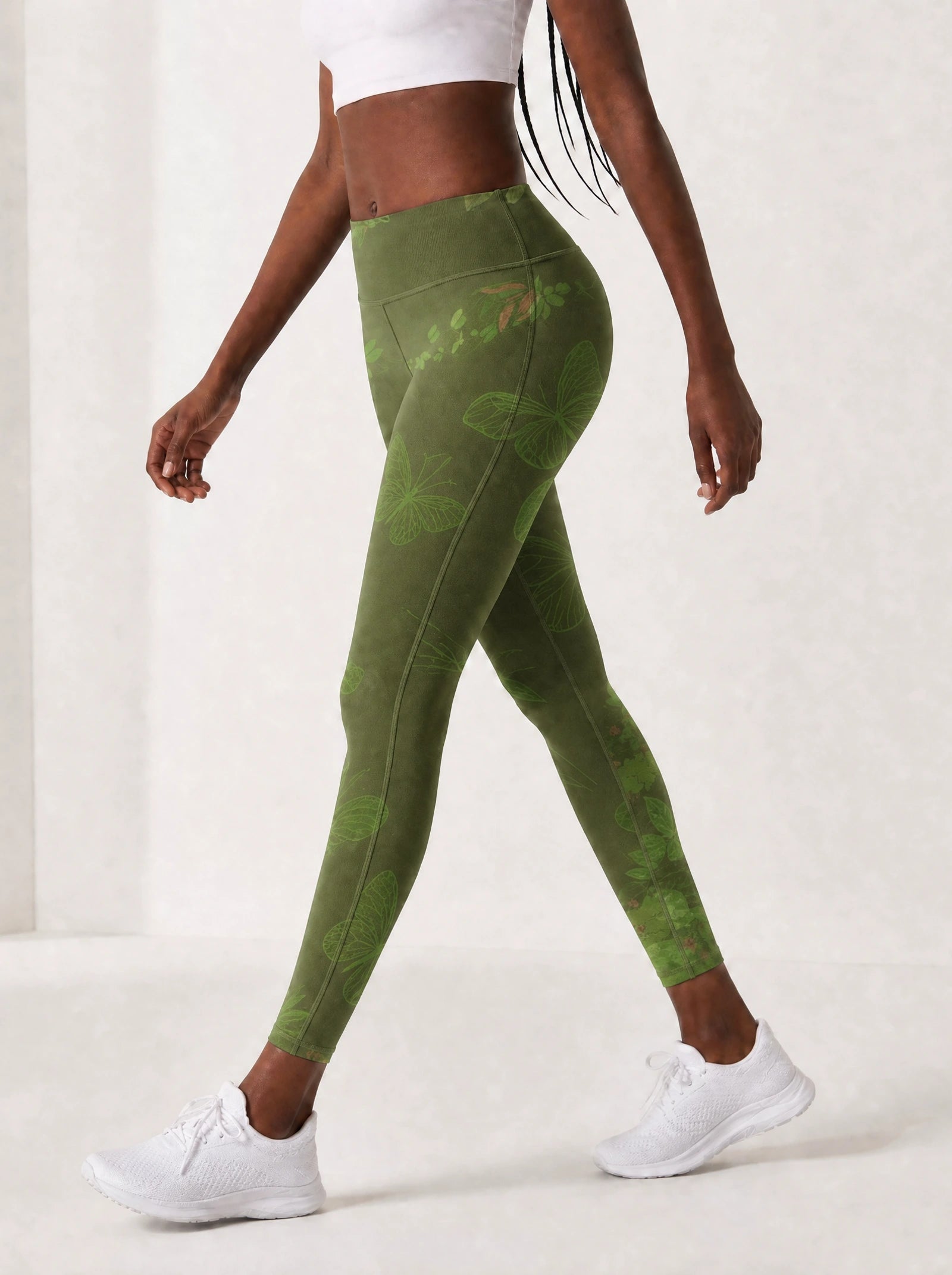 Green Orchid Leggings — side view on model