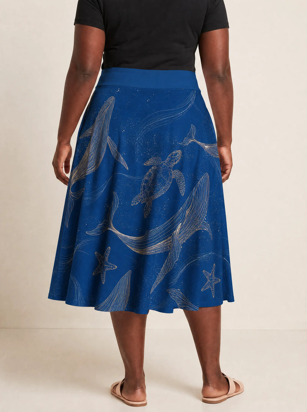 "Pwani" Twirl Skirt — cropped back view on model